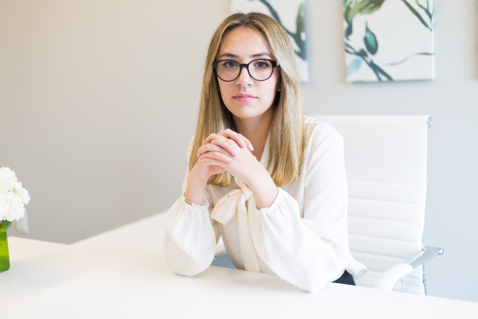 A professional seated in a calm private-practice office.